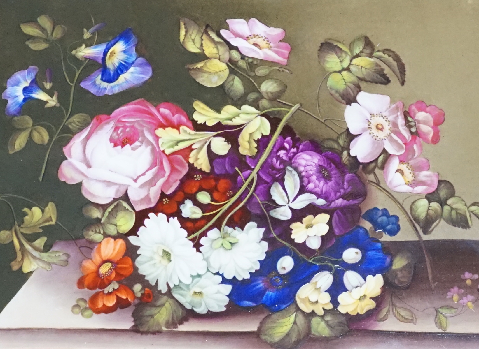 A 19th century English porcelain plaque of flowers on a ledge, in gilt frame, overall 41 x 35cm